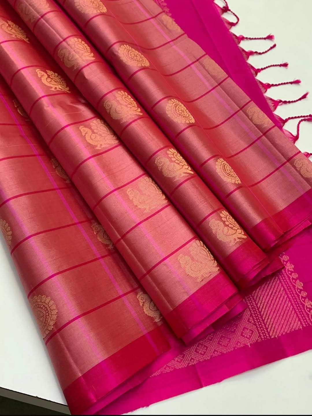 Showcasing handwoven borderless soft silk Sarees in checked design with Annan & chakra motifs.R