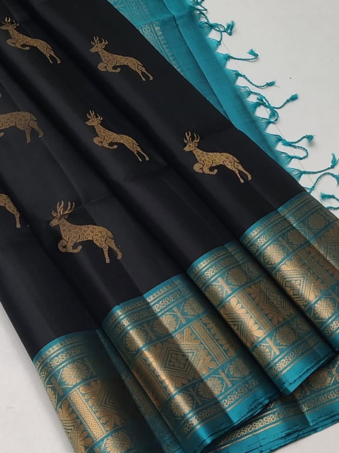 Showcasing handwoven soft silk saree in dark violet & black colour with contrast border, pallu